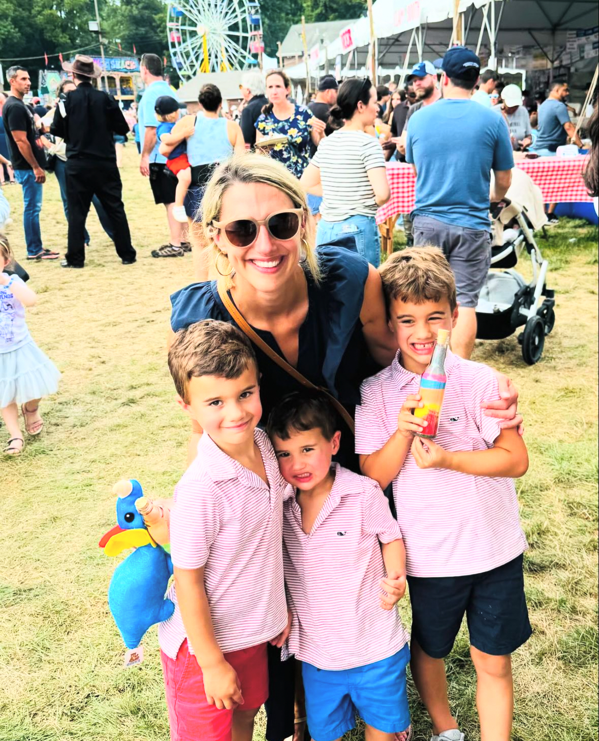 Mayor Simmons smiles with her kids at the St Leos Fair