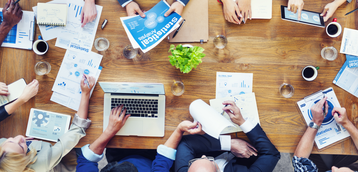 overhead view of group sitting at conference table